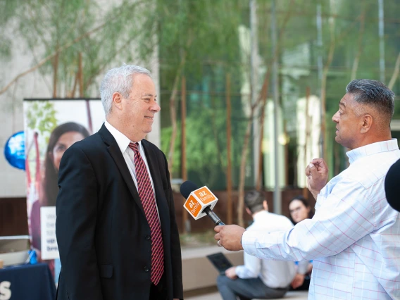 Eric Reiman, MD, chief executive director of Banner Research and principal investigator for All of Us UArizona-Banner, is interviewed by a reporter from Arizona Family 3TV Phoenix during the media luncheon at the Phoenix Bioscience Core.