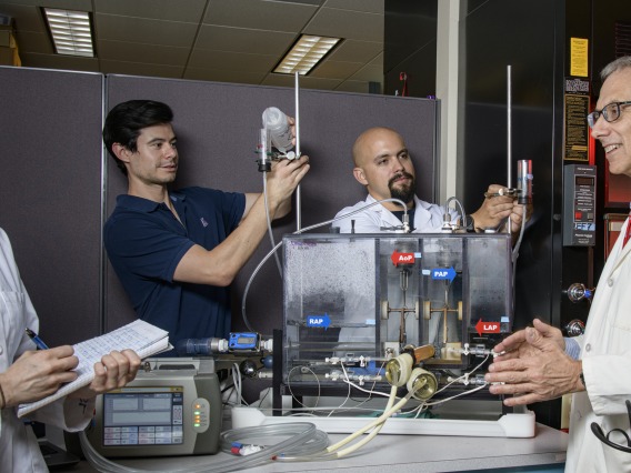 Left to right: Alice Sweedo, PhD candidate; Samuel Miller-Gutierrez; Daniel Palomares (PhD student); and Marvin J. Slepian, MD