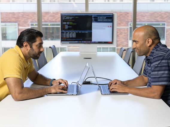 Syed Shujaat Ali Zaidi, PhD, (left) and Rudramani Pokhrel, PhD (right), are working with researchers to apply computational techniques to rapidly accelerate the pace of host-microbe research as part of Personalized Defense, a University of Arizona Health Sciences initiative.