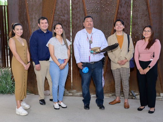 (From left) Jessmin Fernandez, Christopher Danny, Niomi Tsingine, Miguel Flores Jr., Rudy Smith and Micaryn Begay gather after the blessing ceremony. 