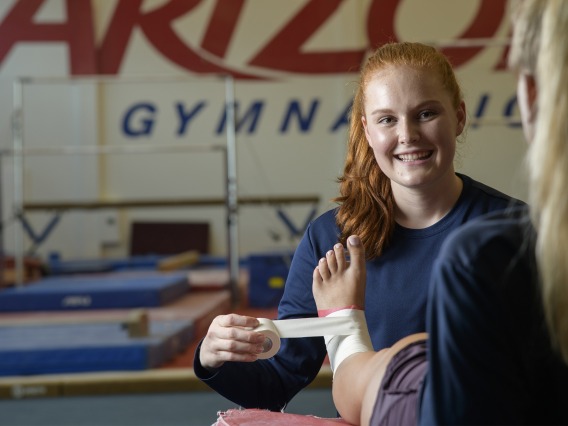 In addition to her role as an undergraduate research assistant, Mikayla Campagne works as an athletic training technician for the UArizona women’s gymnastics team. 