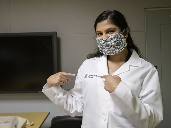 First-year medical student Maithili Khandekar proudly displays her white coat.