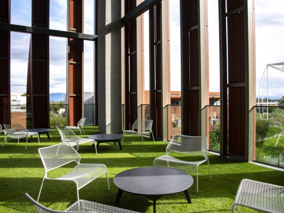 Outdoor spaces on the upper floors of the building offer covered, panoramic views and access to natural elements.