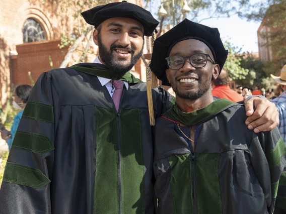 Abdullah Aleem Mian, MD, and Andrew Muse, MD, pose for a photo together after the College of Medicine – Tucson class of 2022 convocation at Centennial Hall.