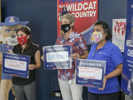 Faculty at the Mel and Enid Zuckerman College of Public Health on the Phoenix Biomedical Campus share their signs. From left: Leila Barraza, JD, MPH, associate professor, Janet Foote, PhD, assistant professor and Alma Ramirez, health educator.