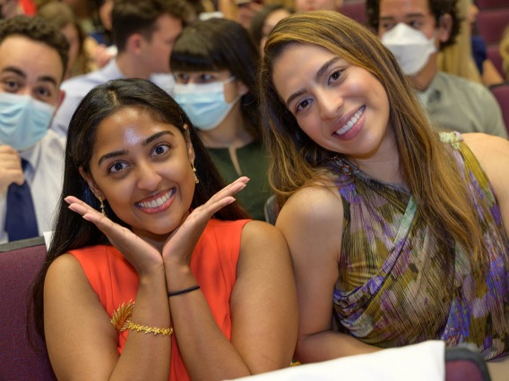 (From left) Martina Francis and Camila Hurtado wait for the UArizona College of Medicine – Tucson Class of 2026 white coat ceremony to begin.  