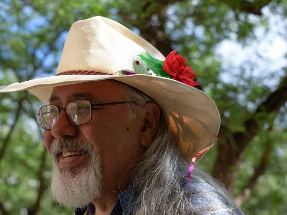Carlos Gonzales, MD, watches as medical students plant a tree honoring those who donated their bodies to the Willed Body Program at the College of Medicine – Tucson.