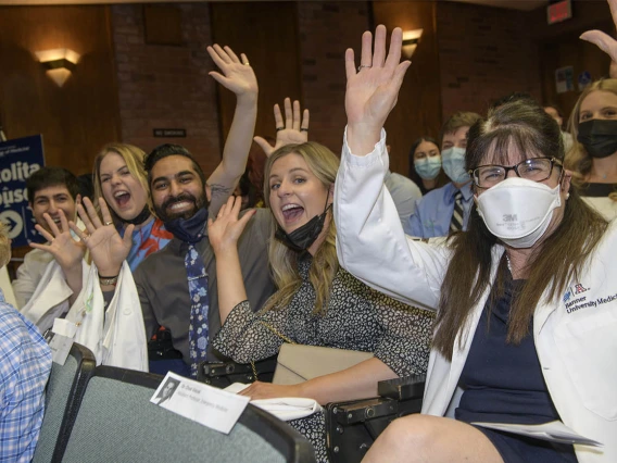 Members of the College of Medicine – Tucson Tortolita House show their excitement prior to the start of their twice-postponed white coat ceremony. 