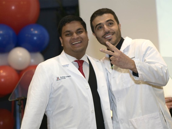 Abhimanyu Chadha (left) pauses for a photo after receiving his white coat from Ahmad Al-Khashman, MD, clinical assistant professor at the UArizona College of Medicine – Tucson.