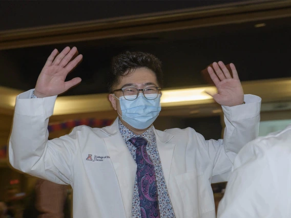 Lawrence Sun gives a “woot, woot” after the UArizona College of Medicine – Tucson’s class of 2024 white coat ceremony.