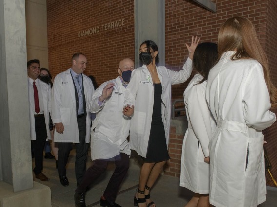 Both faculty and students couldn’t help but do a little dance after UArizona College of Medicine – Tucson class of 2024 finally had their white coat ceremony. The ceremony had been postponed twice over the past two years due to the pandemic.  