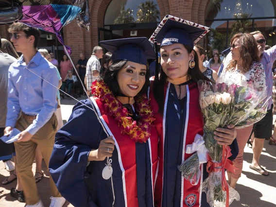 (From left) Ana Maria Walker and Misty Lafranier pose for a photo together after the UArizona College of Nursing 2022 spring convocation at Centennial Hall. 