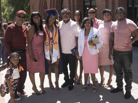 Jasmyn Countee poses for a photo with her family after being awarded a Bachelor of Science in Nursing at the UArizona College of Nursing 2022 spring convocation at Centennial Hall.