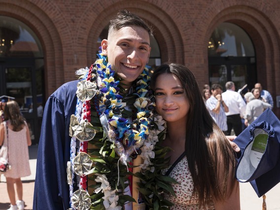 Alex Garcia Quezada poses for a photo with his girlfriend Elizabeth Walter after being awarded a Bachelor of Science in Nursing at the UArizona College of Nursing 2022 spring convocation at Centennial Hall.