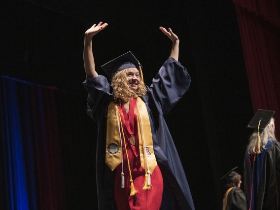 Jaquelyn Gadziala celebrates after being pinned and receiving her Bachelor of Science in Nursing during the UArizona College of Nursing 2022 spring convocation at Centennial Hall.¬