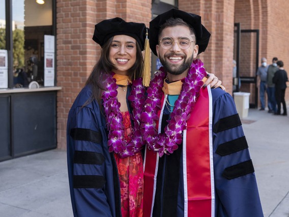 Olivia Mills poses for a photo with her best friend, Jimis Shukri, before they go into Centennial Hall for the College of Nursing fall convocation.