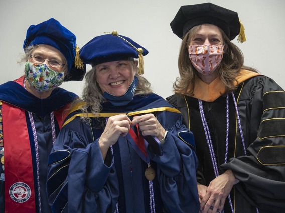 College of Nursing faculty (from left) Ruth Taylor-Piliae, Heather Carlisle and Sheri Carson wait for the fall convocation to begin at Centennial.