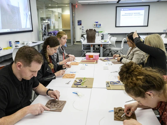 UArizona College of Nursing Doctor of Nursing Practice students try their skills at wound suturing during the first clinical immersion of the year. 
