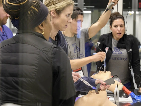 Nurse Anesthesiology Doctor of Nursing Practice students practice intubation technique during a UArizona College of Nursing clinical immersion session.