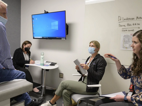 A patient answers questions from UArizona Doctor of Nursing Practice students during a clinical immersion session.