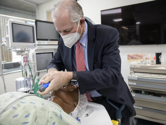 University of Arizona President Robert C. Robbins, MD, who said it had been about 35 years since he had performed an intubation, asked to give it a try after the CRNA students had finished their simulation. The procedure was successful, and the manikin survived.  