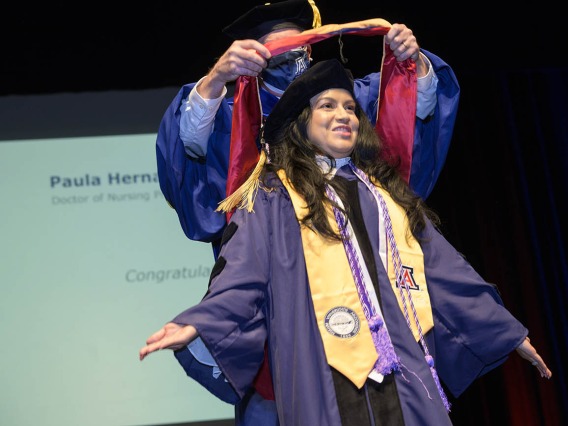 Paula Hernandez is hooded during the UArizona College of Nursing fall convocation after earning a Doctor of Nursing Practice degree. 