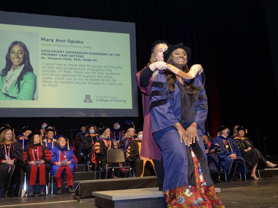 Mary Ann Opoku is hooded for earning a Doctor of Nursing Practice degree during the UArizona College of Nursing fall convocation at Centennial Hall on Dec. 15. 
