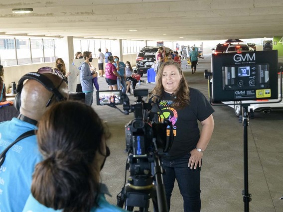 Arizona SciTech Institute’s Chief Operating Officer, Kelly Greene, records a message during the Connect2STEM event that her organization sponsored along with UArizona Health Sciences and Cox Communications.         