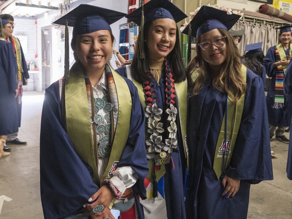 Bachelor of Science in Pharmaceutical Sciences graduates (from left) Rolonda Slim, Cielo Perez and Aimee Nguyen pause for a photo backstage in Centennial Hall before the start of the R. Ken Coit College of Pharmacy 2022 spring convocation.