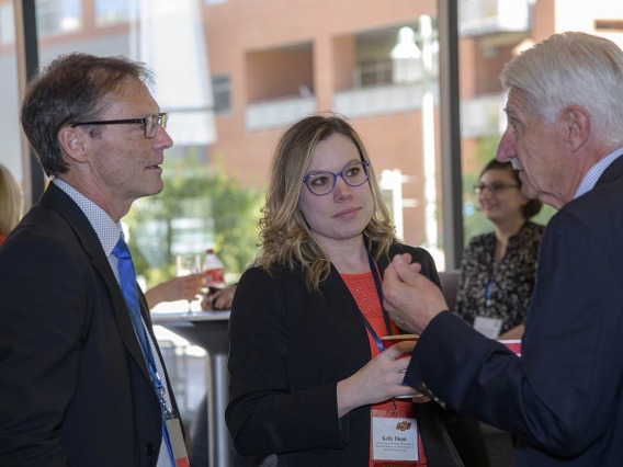 Don Kyle, PhD, CEO of the National Center for Wellness and Recovery at Oklahoma State University, and Kelly Dunn, PhD, executive director of the NCWR’s Addiction Treatment Center, chat with Frank Porreca, PhD, professor of pharmacology and principal investigator on the “Center of Excellence for Addiction Studies” grant, during a coffee break.
