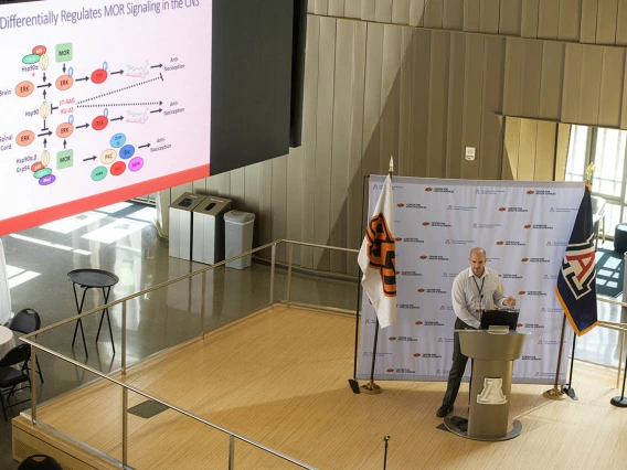 John Streicher, associate professor of pharmacology in the College of Medicine – Tucson, gives a presentation on his research into improving opioid therapy by uncovering the molecular signaling cascades of the opioid receptors.