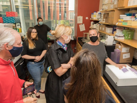 Deborah Birx, MD (center), coordinator of the White House Coronavirus Task Force, recently visited University of Arizona Health Sciences labs where researchers are testing antibody and antigen samples collected from students and employees. UArizona President Robert C. Robbins, MD (far left), joined her on the tour.