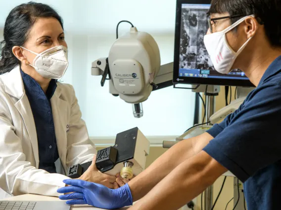 Clara Curiel-Lewandrowski, MD, and Dongkyun Kang, PhD, are collaborating to create a portable, less expensive version of a skin cancer diagnostic microscope.