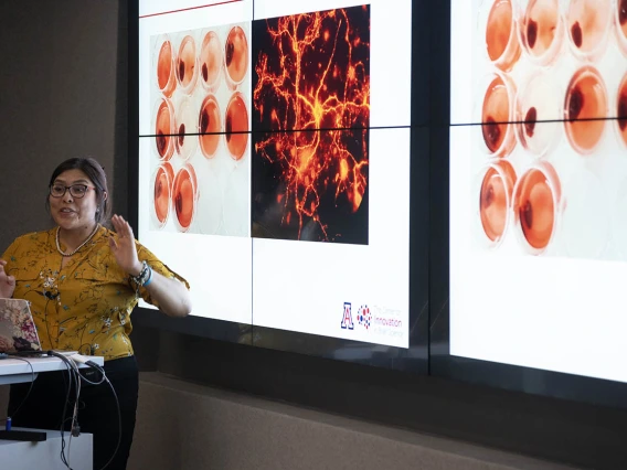 Diné College student Alyssa Joe presents on her ALS-focused research project to an audience of colleagues, professors and mentors from the UArizona Health Sciences Center for Innovation in Brain Science.