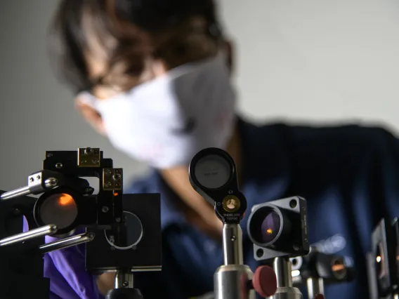 Dongkyun Kang, PhD, works on the laser light portion of a new, portable skin cancer diagnostic technology he is developing with Clara Curiel-Lewandrowski, MD.