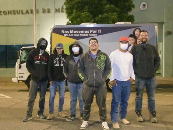 Farmworkers from Agua Prieta, Mexico, gather before dawn at the Mexican Consulate in Douglas for a COVID-19 vaccine clinic hosted by the UArizona Health Sciences, Cochise County Health Department (from left): Oscar Moreno, Mara Rodríguez, Jairo López, Rubén Sosa, Nestor Quiñonez, and Jesús Pérez.