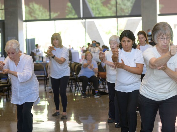 Members of Edna Silva’s Center for Wu Style Tai Chi Chuan demonstrate tai chi at the Feast for Your Brain community event on Sept. 10. 