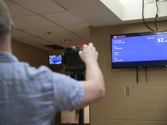 Erich Healy films an incoming call at the fire station during the training exercise. Healy works for the Mel and Enid Zuckerman College of Public Health and the Western Regional Public Health Training Center.