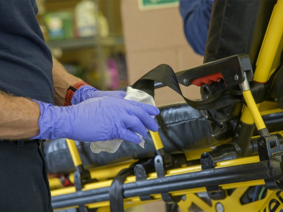 Tucson Fire Department personnel sanitize equipment after transporting a possible COVID-19 patient to the hospital. The University of Arizona Mel and Enid Zuckerman College of Public Health worked in conjunction with Tucson Fire Department and the Western Regional Public Health Training Center to create a training video about protocols for first responders to avoid infection during an outbreak.