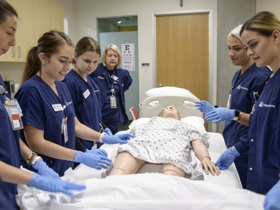 University of Arizona nursing students simulate patient care with a manikin at the College of Nursing in Gilbert, Ariz. in 2019.