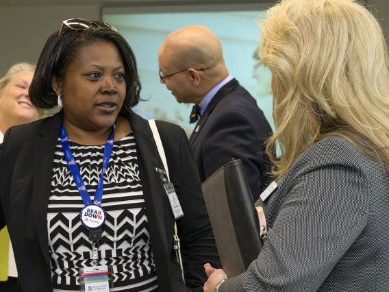 Carla Holloway (left), MEd, the university’s executive director of distance and continuing education, visits with Debbie Robinson, clinical placement coordinator for the College of Nursing, after the ribbon-cutting ceremony in Gilbert, Arizona. 