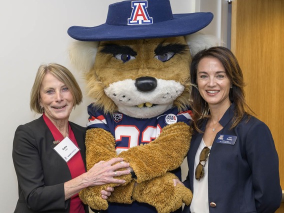 Kathleen Insel, PhD, (left) interim dean of the UArizona College of Nursing, celebrates the opening of the college’s new facility in Gilbert, Arizona, with Wilbur Wildcat and Lisa Rulney, MBA, University of Arizona senior vice president and chief financial officer of business affairs. 