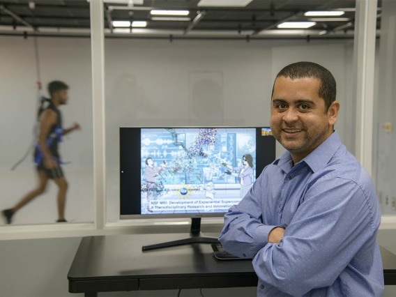 Dr. Almeida shows off one of two Sensor Lab rooms featuring reconfigurable layout options. The rooms can be prepared with the equipment required by the users and reserved for the conduction of research studies. 