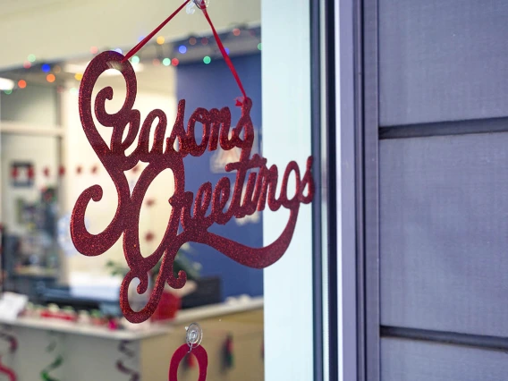 A festive message awaits visitors to the Office of Student Services at the reception area of the R. Ken Coit College of Pharmacy. 