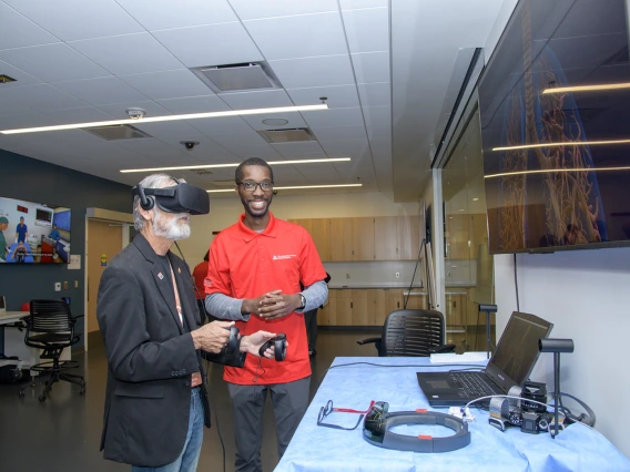 A visitor to the Arizona Simulation Technology and Education Center, or ASTEC, takes a virtual reality tour through the human body.