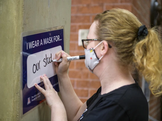 Barbara Moore is an administrative assistant in the Office of Student Affairs at the College of Medicine – Tucson, completes the prompt, “I Wear a Mask For...”