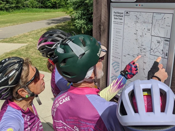 The group discusses the day’s route near Lake Winnibigoshish, Minn.