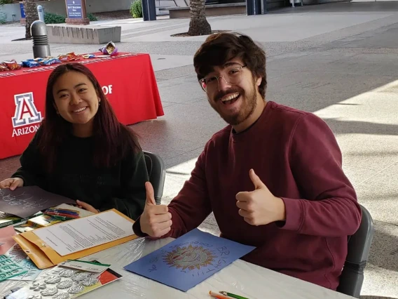 The R. Ken Coit College of Pharmacy Office of Student Services hosted a an end of semester holiday party where Riley Haveman and Sam Ellis, both pharmaceutical science undergraduates, create homemade holiday. 