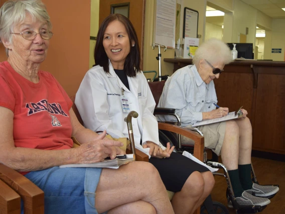 Research led by Dr. Jeannie Lee (center) showed that adults with diabetes or hypertension benefit from physicians, nurses, pharmacists and other health care professionals working together with patients and families. (Photo: University of Arizona Health Sciences/David Mogollon)