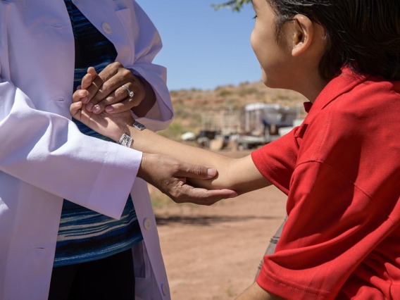 Vanessa Jensen, MD, helps drop off donations for Navajo residents at a community center in Tuba City. The supplies were gathered by University of Arizona College of Medicine – Tucson students who are involved with the Association of Native American Medial students (ANAMS) and the Rural health Professions Program (RHPP).